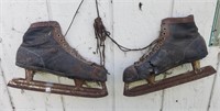 Pair of Vintage Ice Skates Been Hanging on a Barn