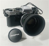 Olympus OM10. 35mm SLR. Black and chrome