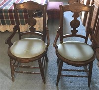 Two ornate matching library chairs w/ padded seats