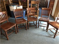 Five matching wooden library/desk chairs