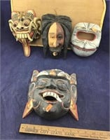 4 Carved Wooden Masks