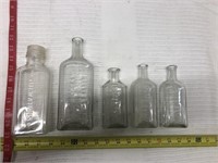 5 vintage Watkins bottles