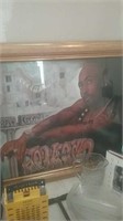 Large gold-framed Tupac print