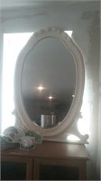 Large white painted oval mirror that it one time
