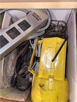 box of light extension cords and flashlight