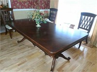 Mahogany finish dining table with two leaves