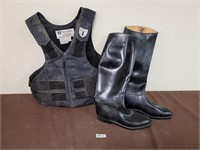 riding boots and safety vest