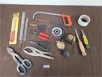 Lot of tools. Saws, plyers, tape, etc