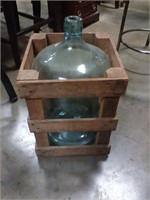 5 gallon blue glass bottle with crate