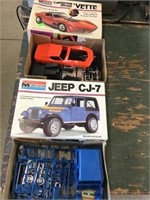 Corvette and Jeep models partially assembled