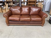 Leather Sofa w/ carved wood accent