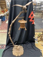 Cast-iron tree branch with eagle and a T light