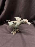 Baby duck with wings out. 7 inches long