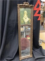 Vintage mirror with little girl picture on top.