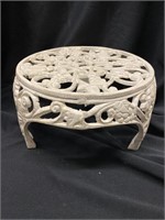 Round cast-iron plant stand. 11 inches in