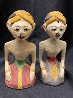Pair of hand carved wooden figurines from