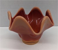 Orange glass dish. About 5.25in diameter, and