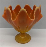Orange glass dish. About 8in diameter, and 7.5in