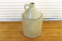 Antique stoneware whiskey jug