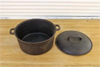 Vintage cast iron pot with lid