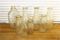 Vintage milk bottles with advertising