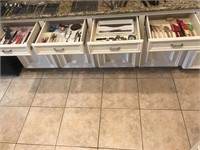 4 drawers of kitchen utensils