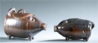 Norman Smith, 2 pottery pigs.