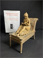 Sculpture of Girl Reading Book