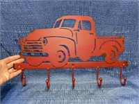 Red metal truck wall hook