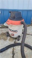 Large rigid commercial shop vacuum.