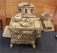 Cast iron stove mechanical bank