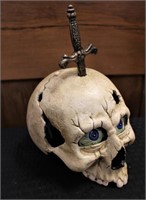 Cast iron skull w/ dagger