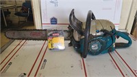 Makita chainsaw in good working condition.