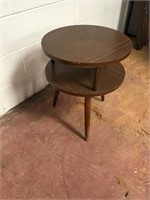 Mid century modern end table shows wear