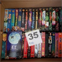 Box full of VHS movies for kids -