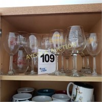 Shelf full of assorted wine glasses