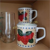 Shelf with strawberry drinking glasses & mugs