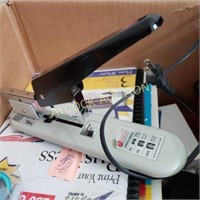 Office supplies - large stapler, phone, rubber