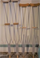 2 pairs of different size aluminum crutches