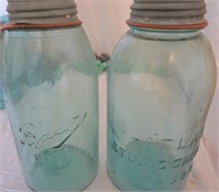 two 1/2 gallon green jars w/ zinc lids