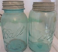 two green quart jars w/ zinc lids