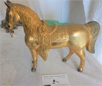 gold colored metal  horse