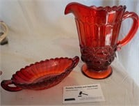 red glass pitcher and candy dish