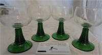 4 green stemmed wine glasses
