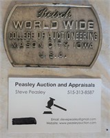 Reisch  college of auctioneering belt buckle