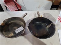 set of 2 cast iron pans.. 11 by 3inch deep and 11