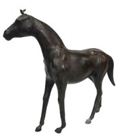 LEATHER-COVERED FIGURE OF A STANDING HORSE