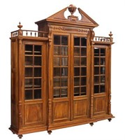 CONTINENTAL CARVED WALNUT BREAKFRONT BOOKCASE