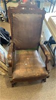 Antique platform rocker on caster wheels,