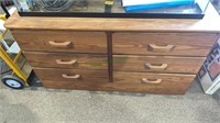 6 drawer pine dresser. Measures 30 inches tall, 56